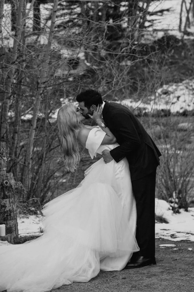 outdoor winter ceremony kiss at Silverthorne Pavilion