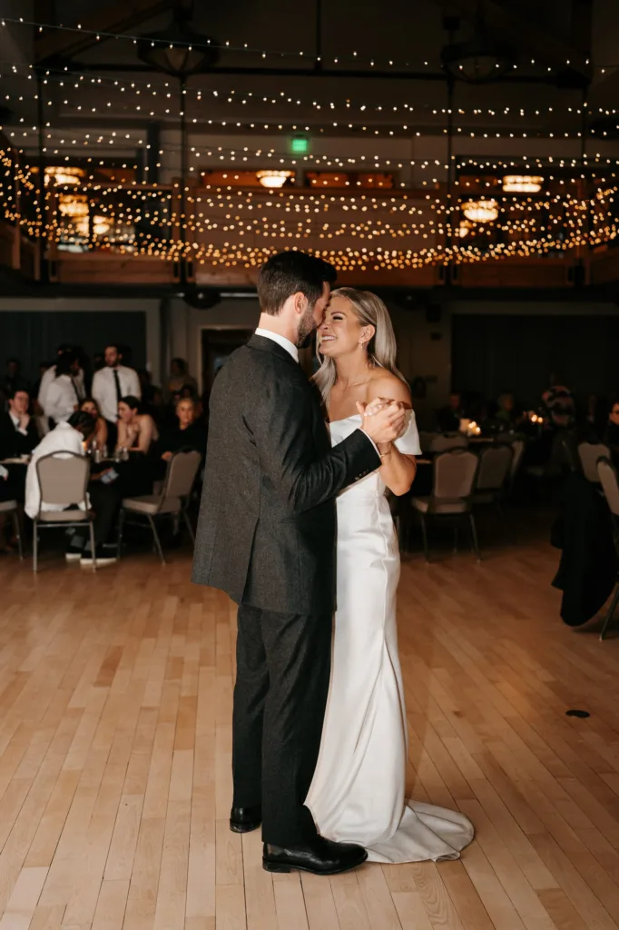 Bride and groom dancing at their wedding reception at Silverthorne Pavilion in Colorado
