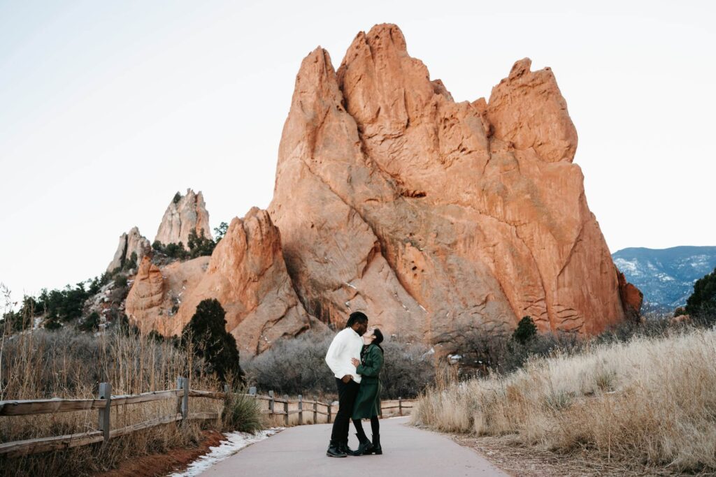 Engagement photographer at garden of the gods in colorado springs taken by a traveling destination wedding and engagement photographer