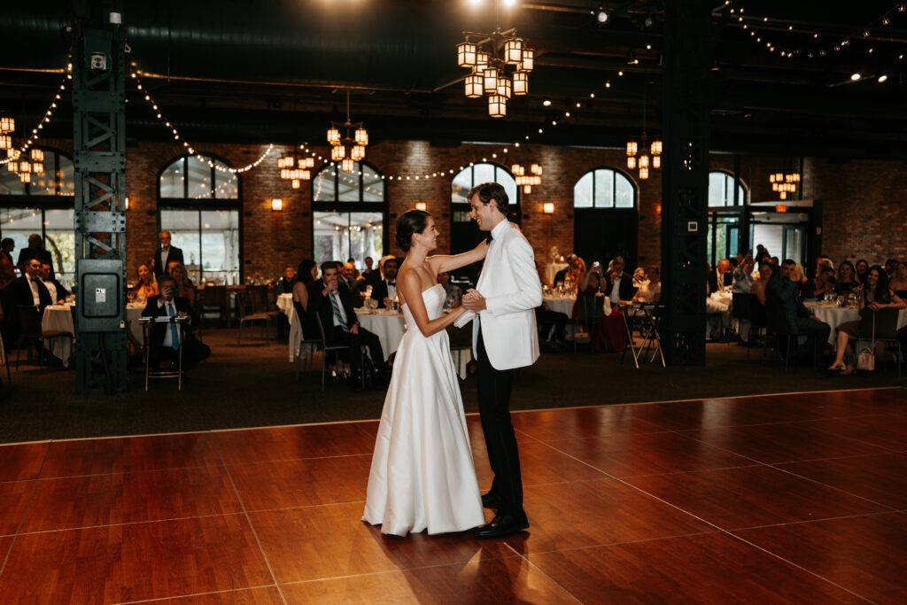 Bride and groom dancing at the Nicollet Island Pavilion on their wedding day, photo taken by Lulle Photo and Film - a minnesota wedding photographer based in Minneapolis. 