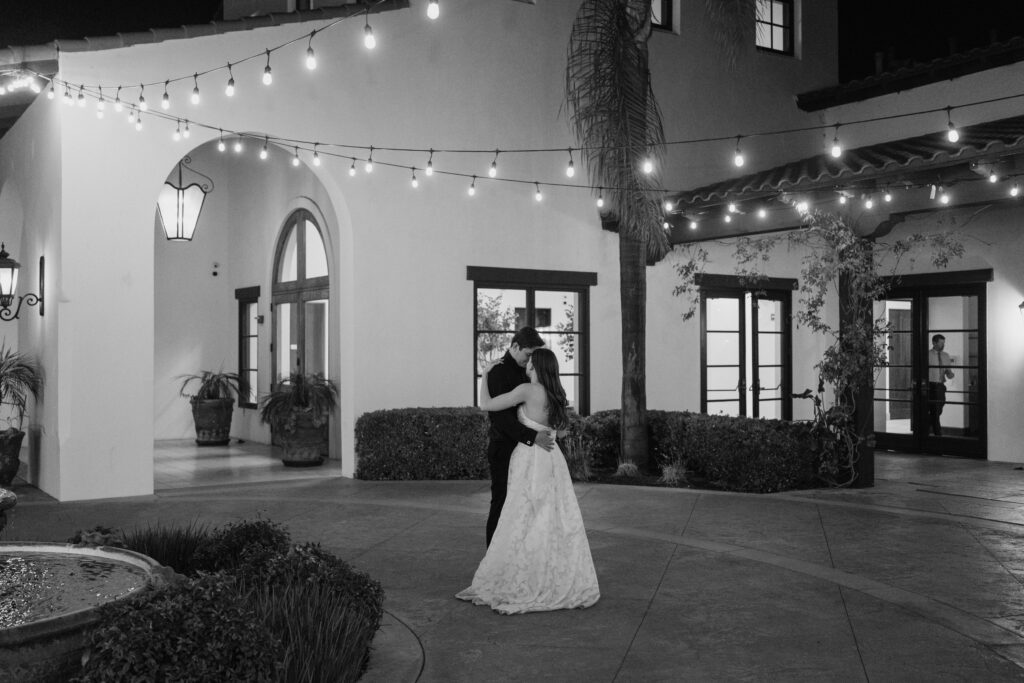 Bride and groom dancing during their San Diego wedding at the Fallbrook Estate, photo taken by Lulle Photo and film a husband and wife wedding photography and videography team
