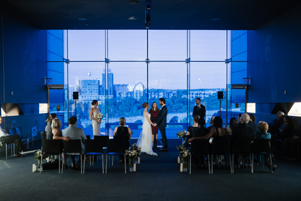 Bride and groom getting married at the Guthrie theater in Minneapolis, a wedding photo taken by Lulle Photo and Film, a wedding photography and videography team based in the Twin Cities in Minnesota. 