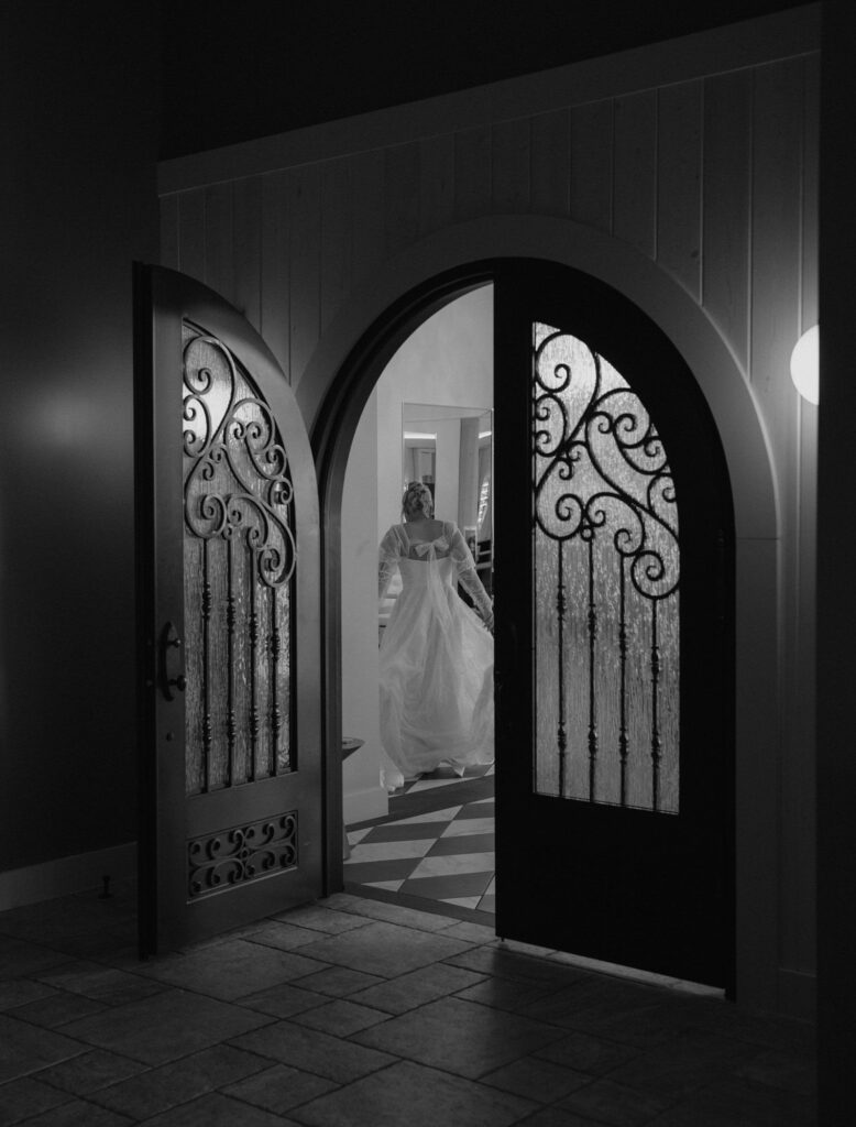 bride walking into the Belmont Suite at Equestria West to get ready for her wedding ceremony in Minnesota.